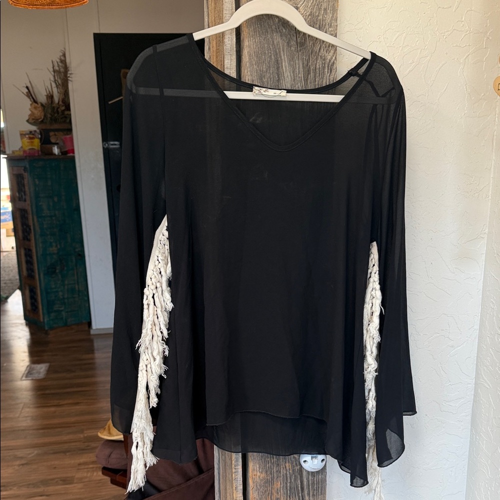 Chic Black Top with White Fringe Accents